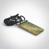 Hand carved New Zealand flower Jade rectangle drop with sterling silver rakau (talking stick) pendant. Made by Ana Krakosky for NZ Pacific in New Zealand Pounamu, jade. A beautiful orange and green marsden flower jade medium sized rectangle drop necklace with silver cast rakau, talking stick, provided on a black adjustable cord.